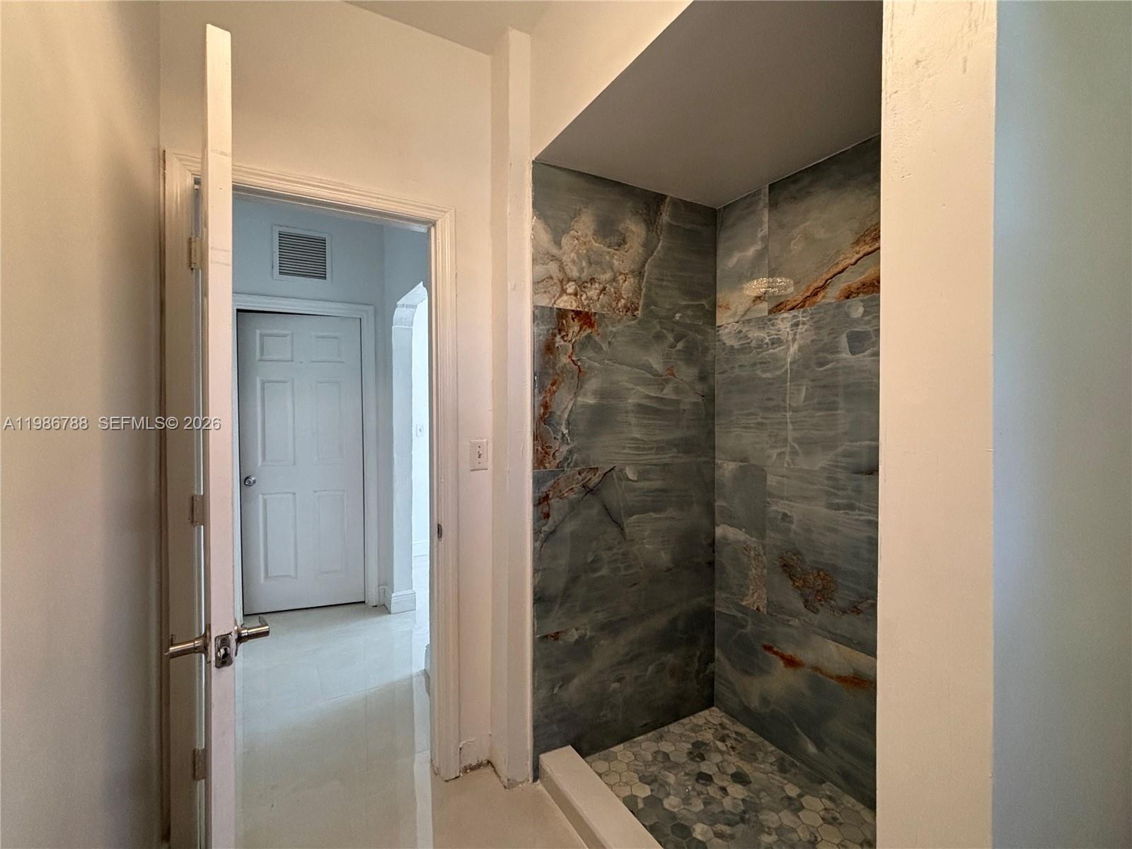 521 Northwest 48th Street Miami, FL 33127 - Photo 10 of 30 a bathroom with a shower