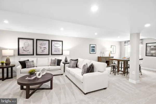 a view of a dining room with furniture and a potted plant