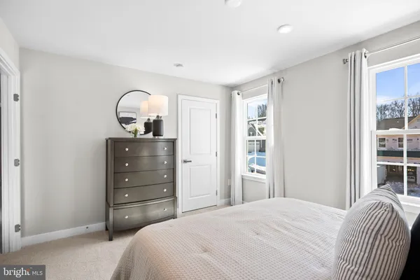 a view of a dining room with furniture and a window