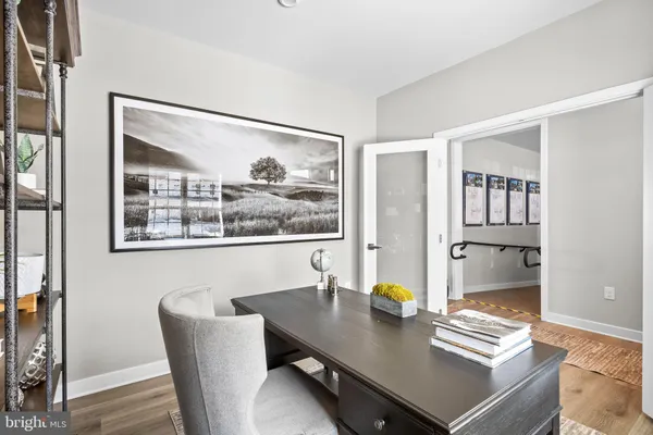 a bedroom with two beds and a mirror