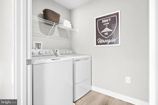 a spacious bathroom with a granite countertop sink and a mirror