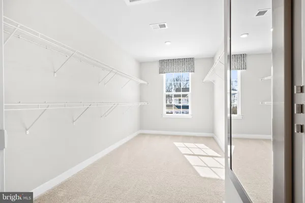 a bathroom with a sink a vanity and a mirror
