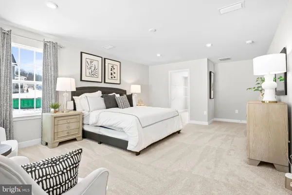 a bathroom with a granite countertop sink a toilet a mirror a vanity and shower