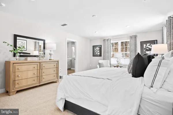 a bed room with a bed and a window