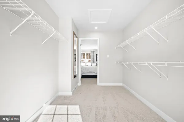 a bedroom with a bed and a painting