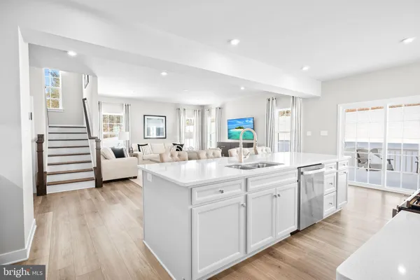a living room with furniture white walls and white walls