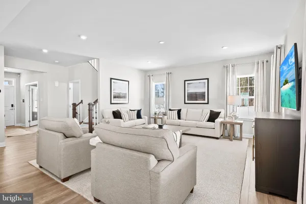 a living room with furniture and a table