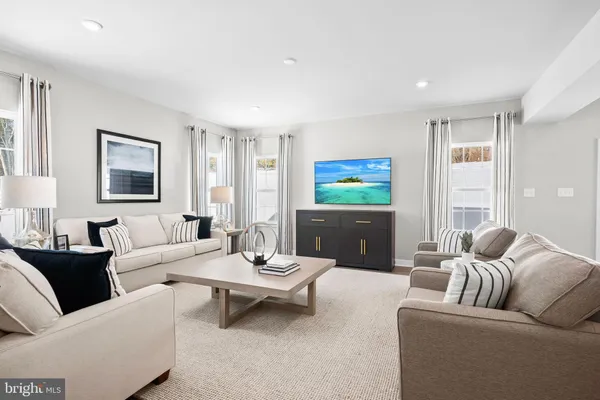 a living room with furniture and a table