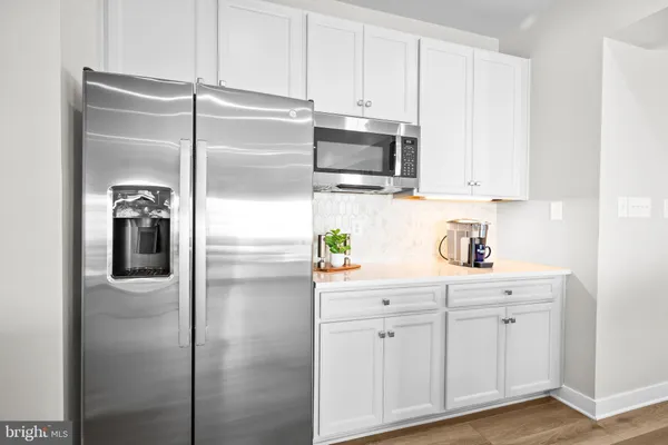 a bathroom with a sink a mirror and a toilet