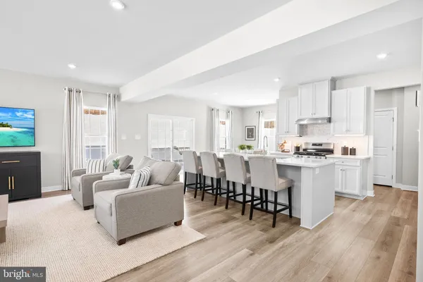 a view of kitchen with cabinets table and chairs