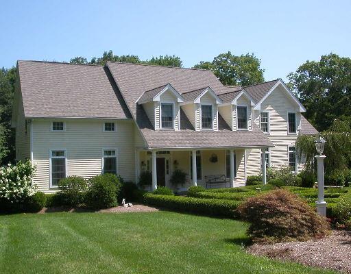 a front view of a house with a yard