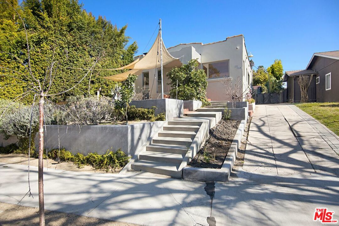 3749 Griffith View Drive Los Angeles, CA 90039 - Photo 2 of 34 a view of a patio with table and chairs potted plants
