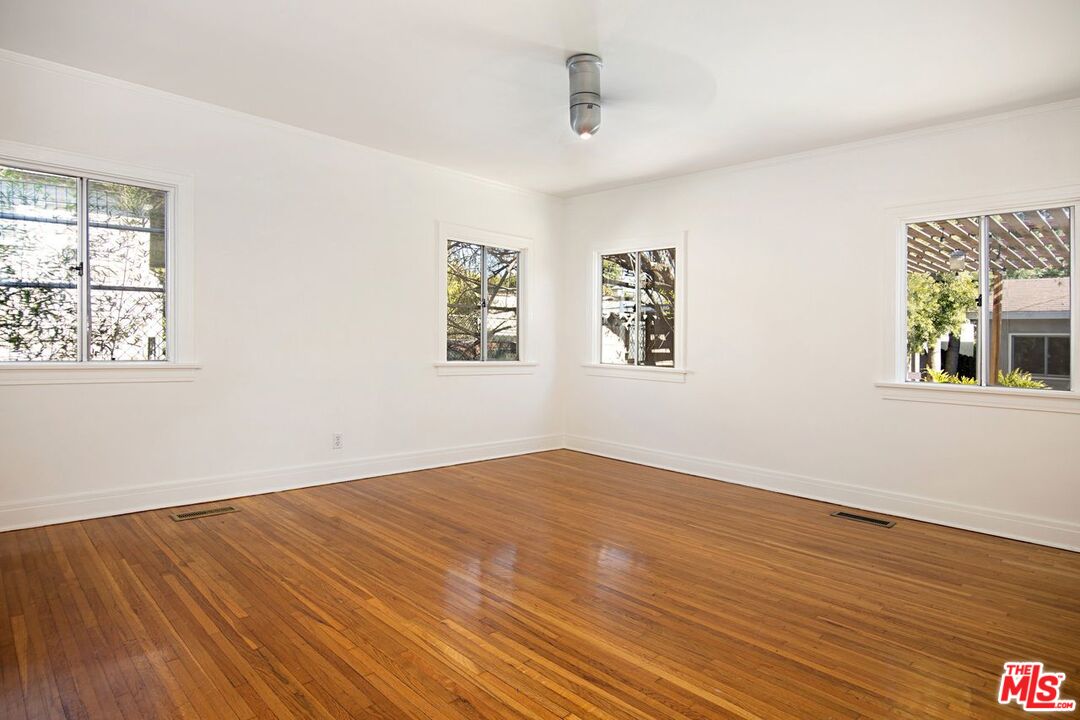 3749 Griffith View Drive Los Angeles, CA 90039 - Photo 17 of 34 a view of empty room with wooden floor and fan