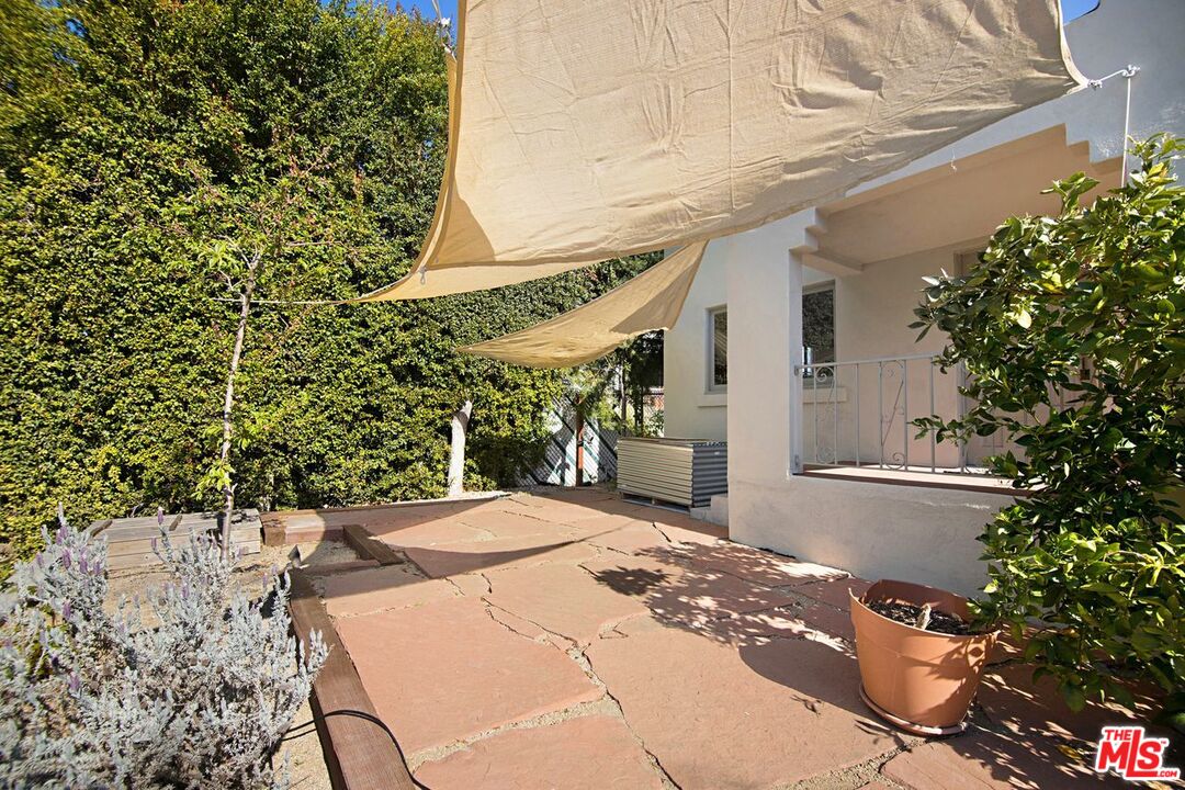 3749 Griffith View Drive Los Angeles, CA 90039 - Photo 3 of 34 a patio with table and chairs and potted plants