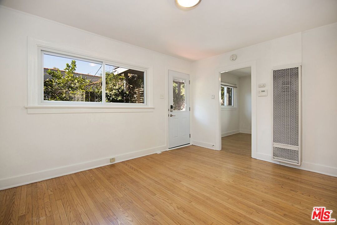 3749 Griffith View Drive Los Angeles, CA 90039 - Photo 22 of 34 an empty room with wooden floor and windows