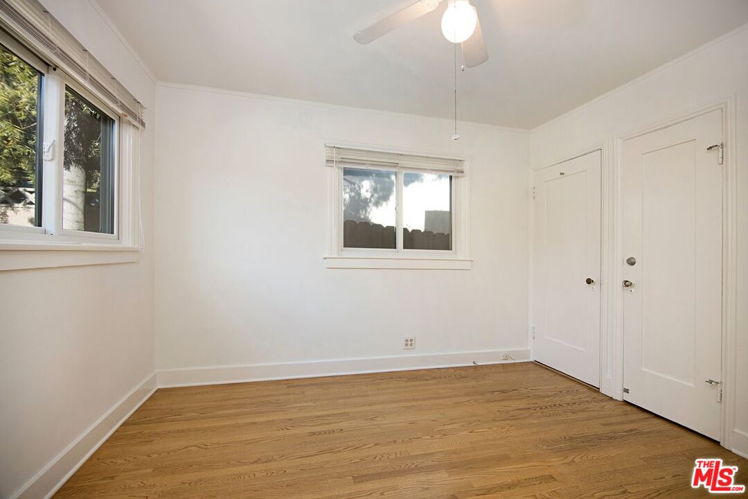 3749 Griffith View Drive Los Angeles, CA 90039 - Photo 23 of 34 a view of empty room with wooden floor and fan