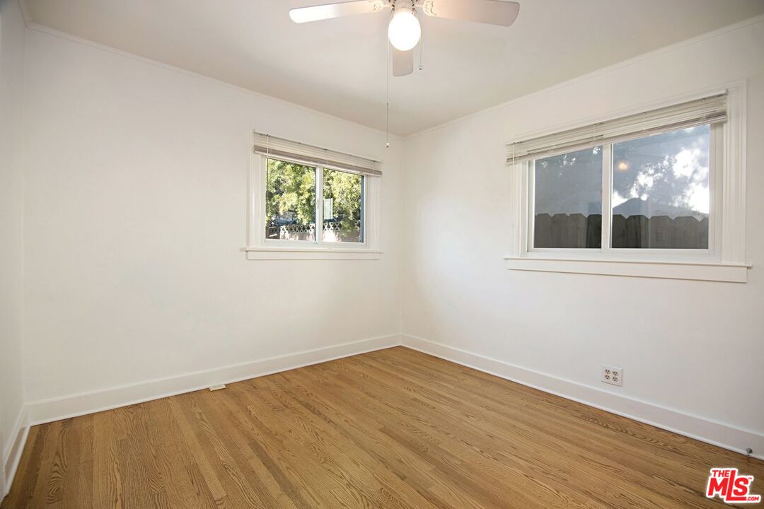 3749 Griffith View Drive Los Angeles, CA 90039 - Photo 24 of 34 a view of empty room with wooden floor and fan