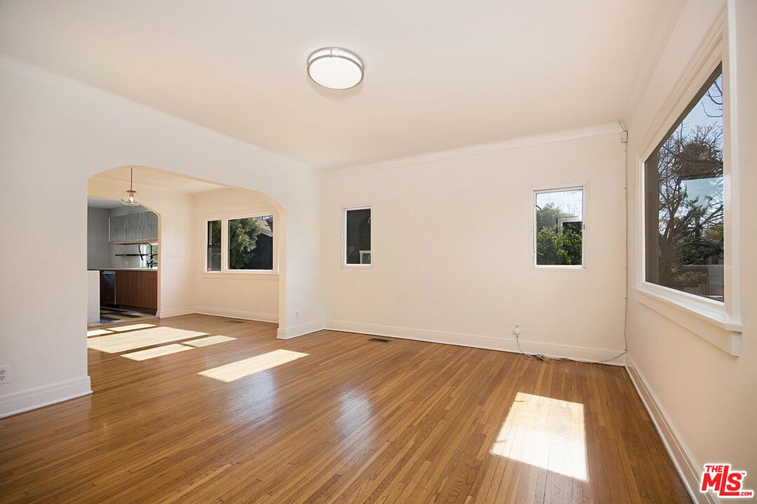 3749 Griffith View Drive Los Angeles, CA 90039 - Photo 5 of 34 a view of an empty room with window and wooden floor
