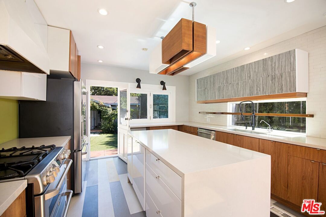 3749 Griffith View Drive Los Angeles, CA 90039 - Photo 10 of 34 a kitchen that has a sink a stove and a wooden floor