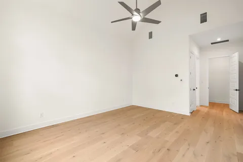 a view of a big room with wooden floor and closet in a room