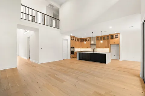 a view of kitchen with sink and cabinets