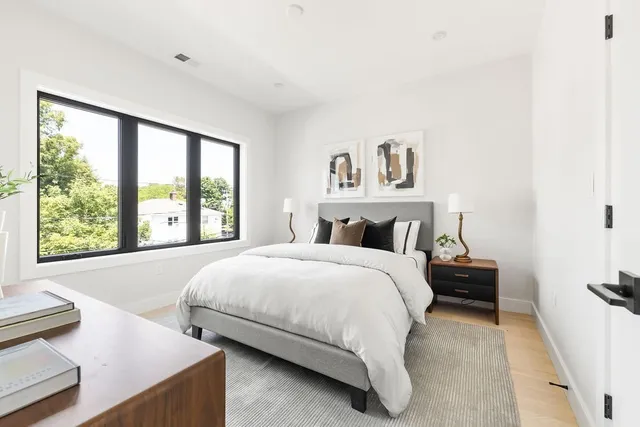 a living room with furniture a rug and a fireplace