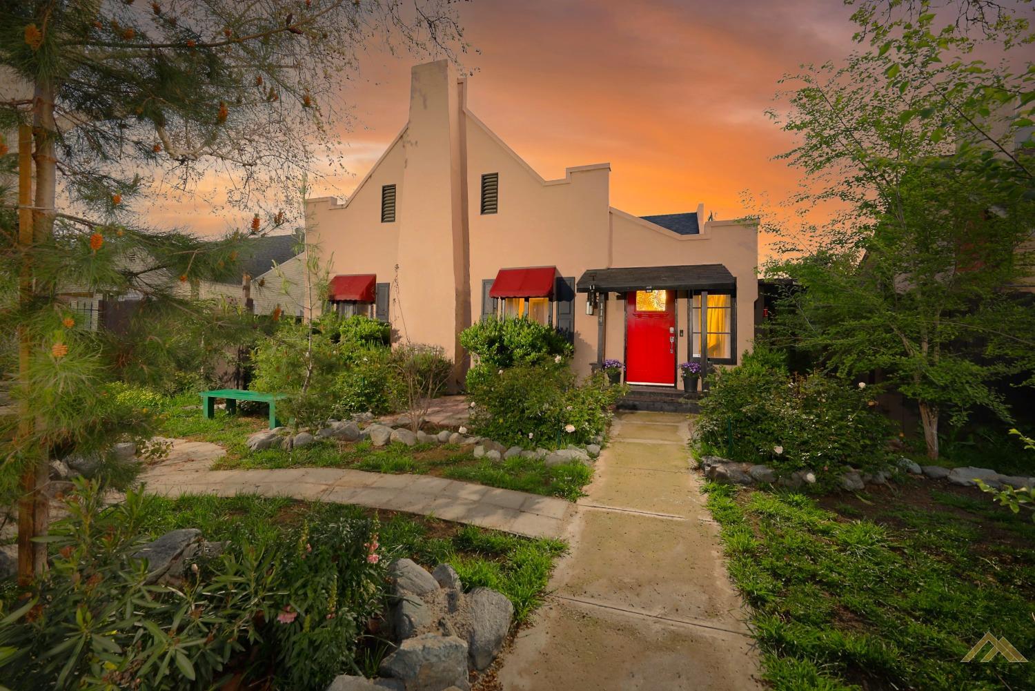 a front view of a house with garden