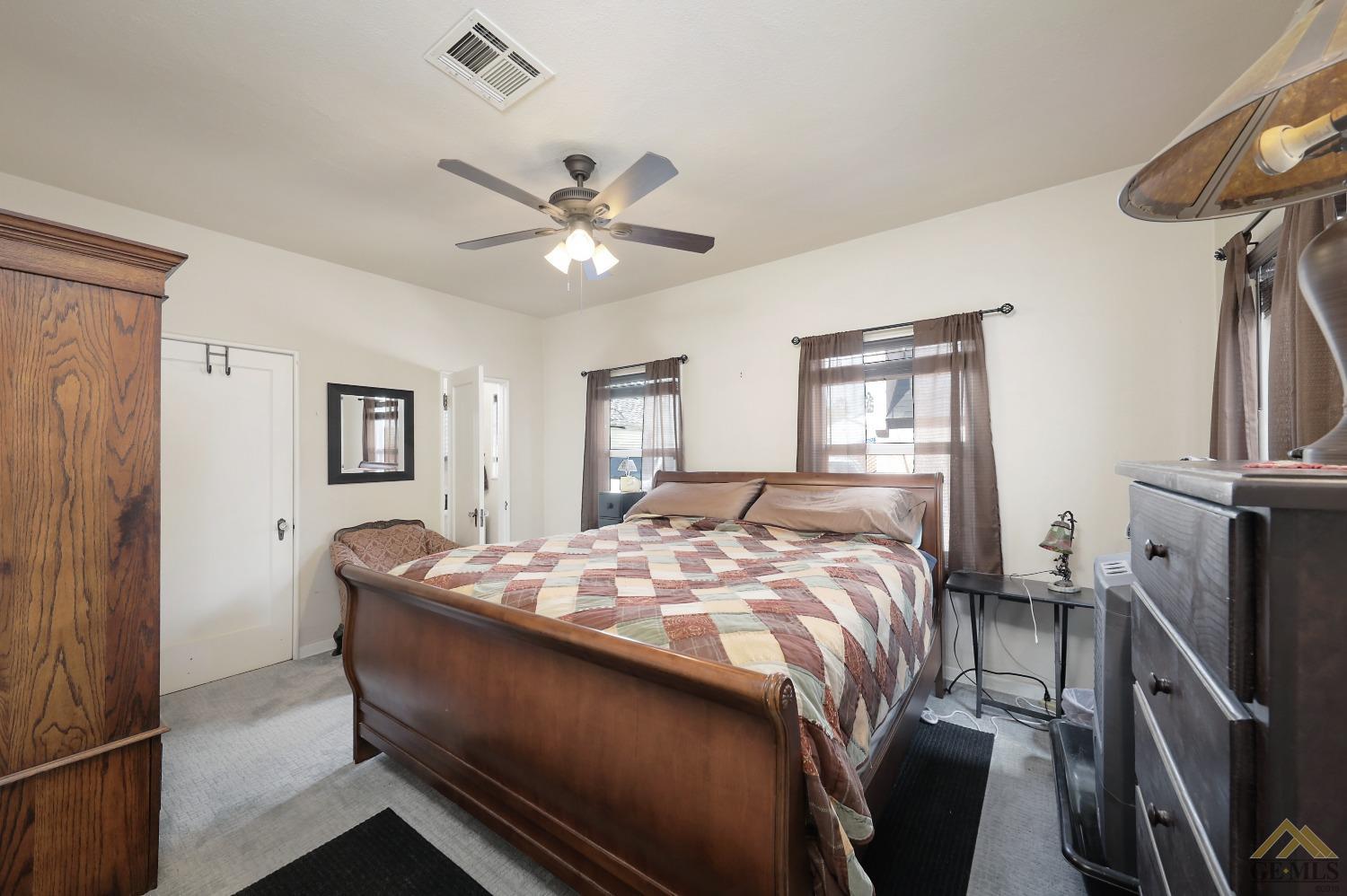 Undisclosed Address Bakersfield, CA 93305 - Photo 14 of 29 a bed sitting in a bedroom next to a window