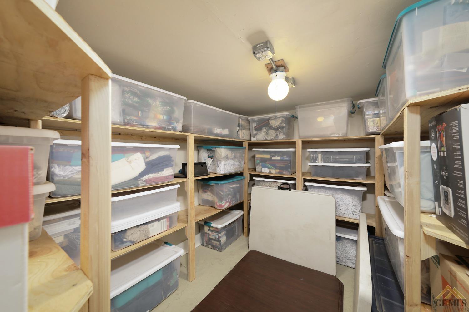 Undisclosed Address Bakersfield, CA 93305 - Photo 19 of 29 a view of a refrigerator in kitchen and an empty room