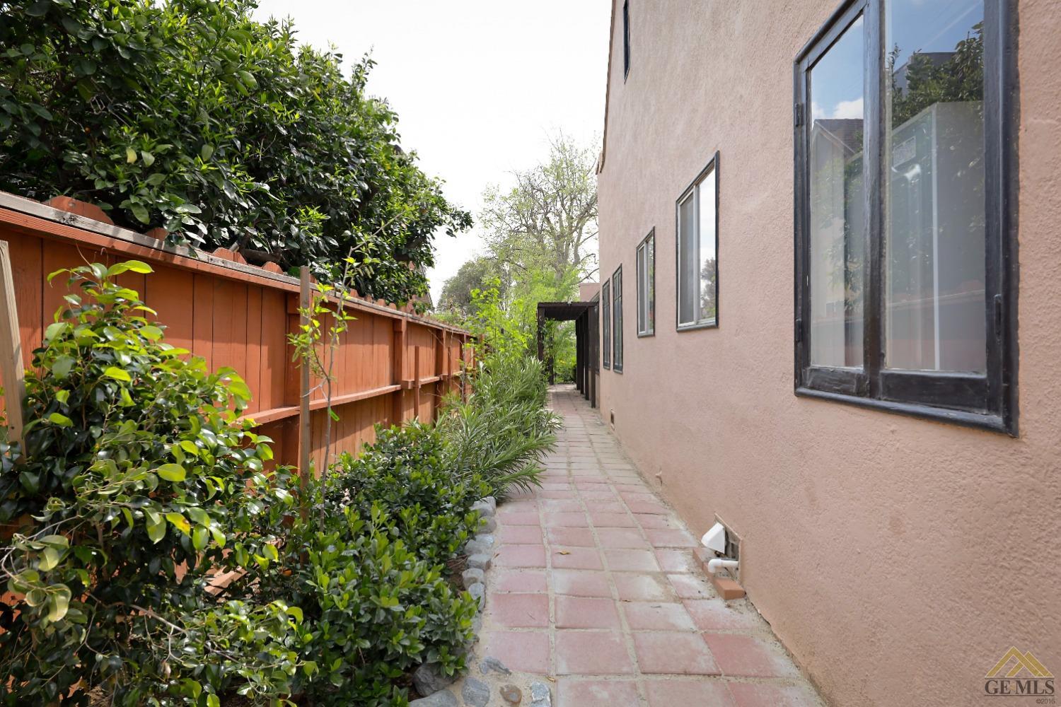 Undisclosed Address Bakersfield, CA 93305 - Photo 23 of 29 a backyard of a house with lots of green space