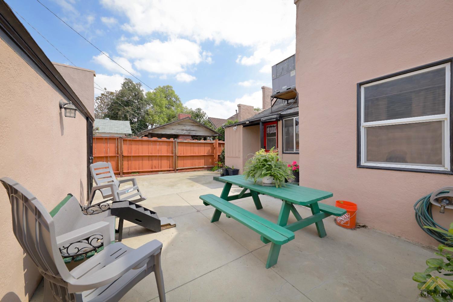 Undisclosed Address Bakersfield, CA 93305 - Photo 24 of 29 a backyard of a house with fire pit and chairs