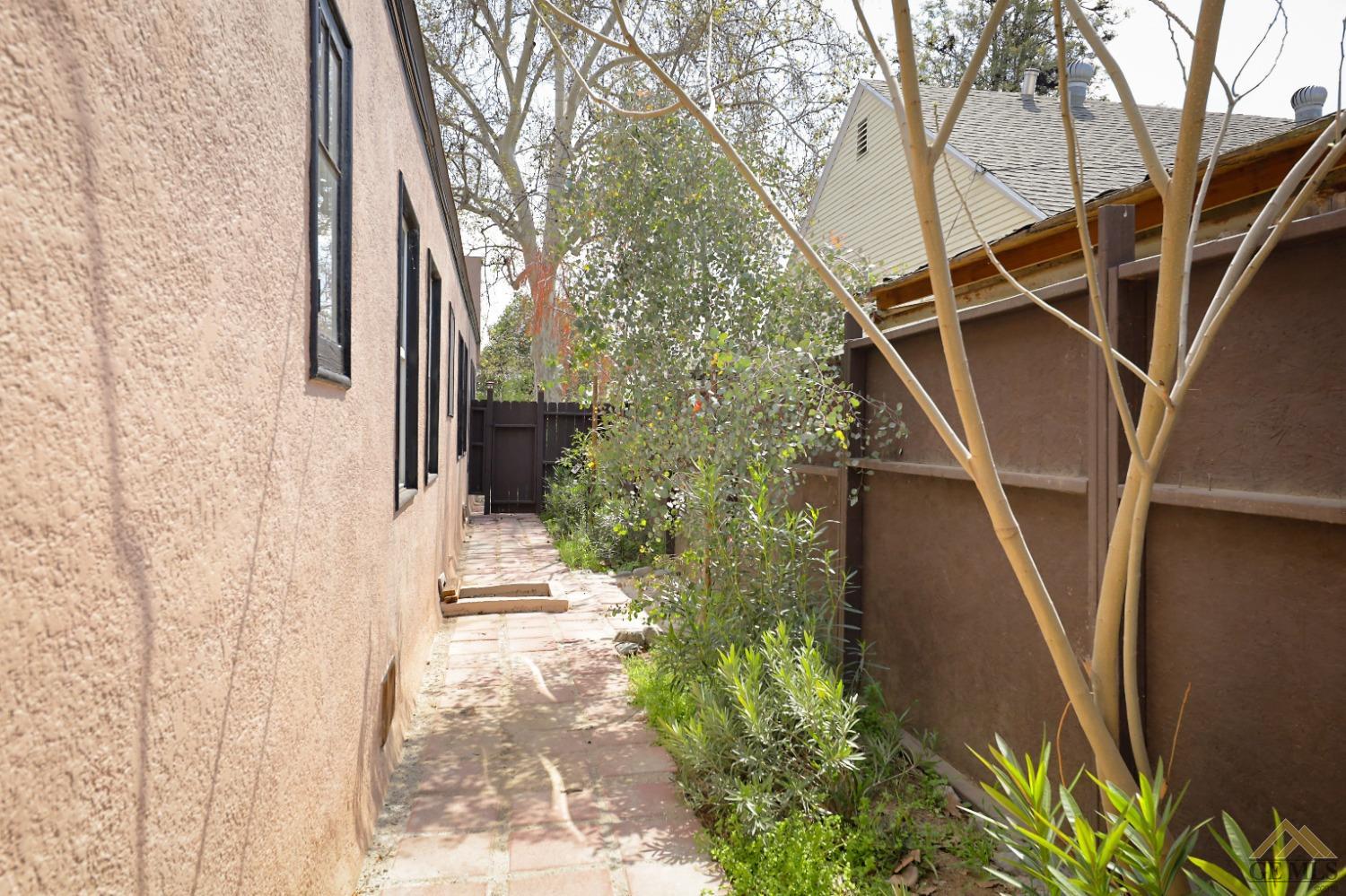 Undisclosed Address Bakersfield, CA 93305 - Photo 26 of 29 a backyard of a house with table and chairs