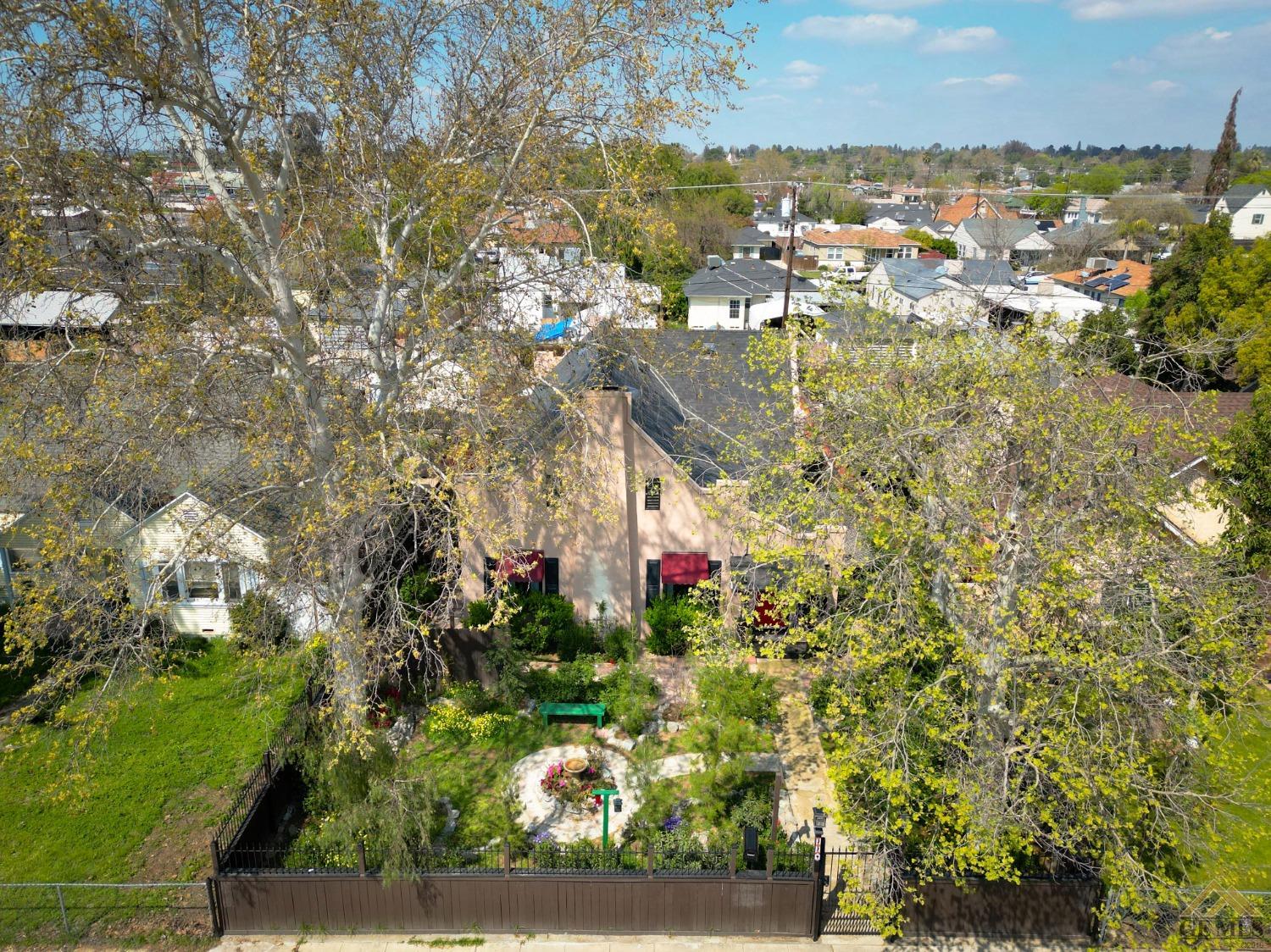 Undisclosed Address Bakersfield, CA 93305 - Photo 4 of 29 a view of residential houses with outdoor space and trees