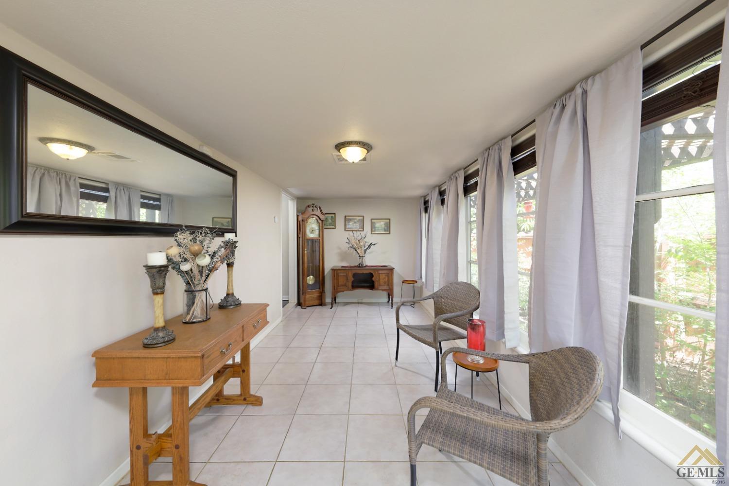 Undisclosed Address Bakersfield, CA 93305 - Photo 6 of 29 a living room with furniture and a window