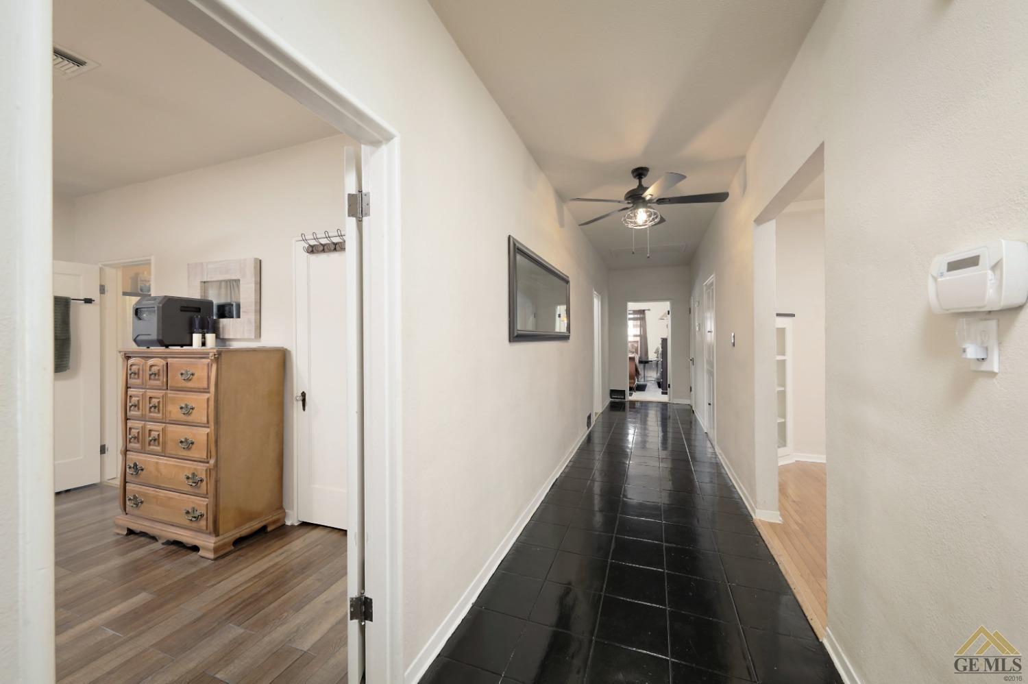 Undisclosed Address Bakersfield, CA 93305 - Photo 9 of 29 a view of a hallway with workspace and closet