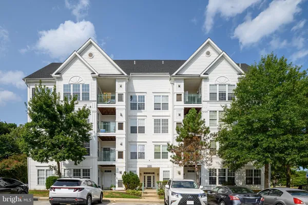 a view of a car parked in front of a building