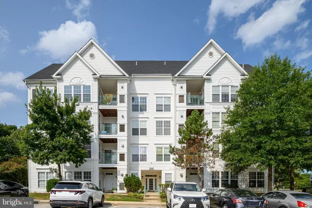 a view of a car parked in front of a building