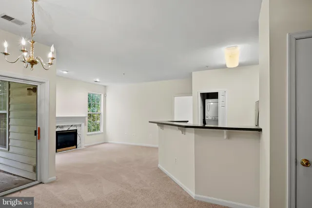 a view of a kitchen with furniture and a ceiling fan
