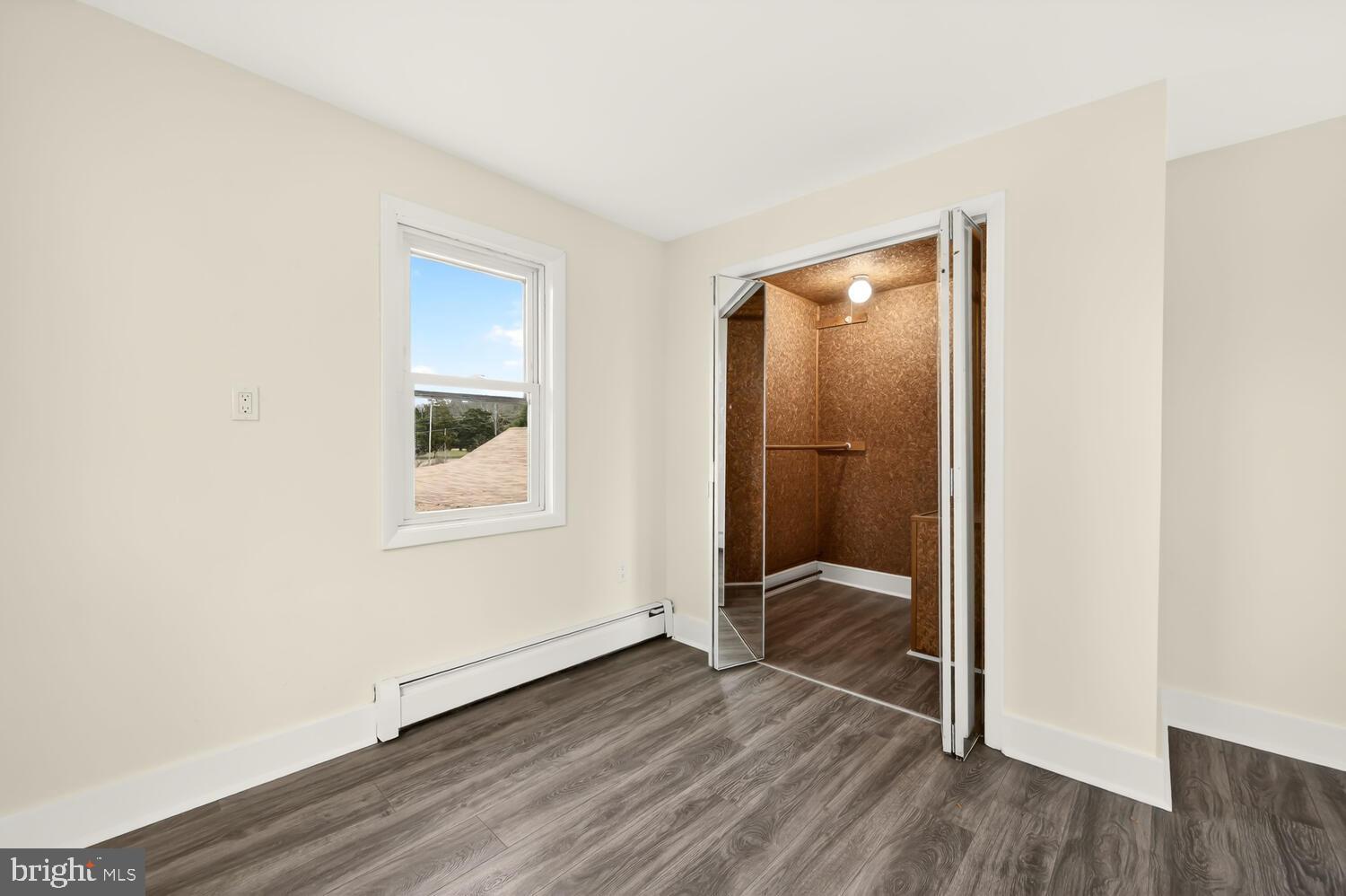 6746 Quaker Neck Road Chestertown, MD 21620 - Photo 45 of 50 a view of an empty room with wooden floor and a bathroom