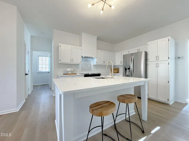 a kitchen with stainless steel appliances granite countertop a sink and cabinets