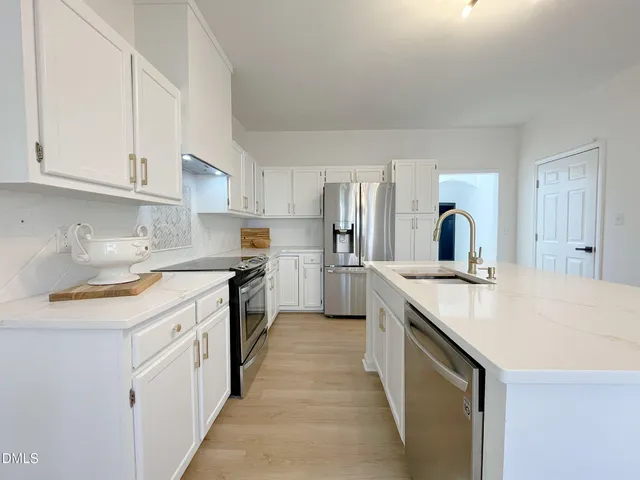 a view of a room with furniture window and wooden floor