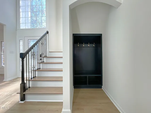 a view of a livingroom with furniture window and wooden floor