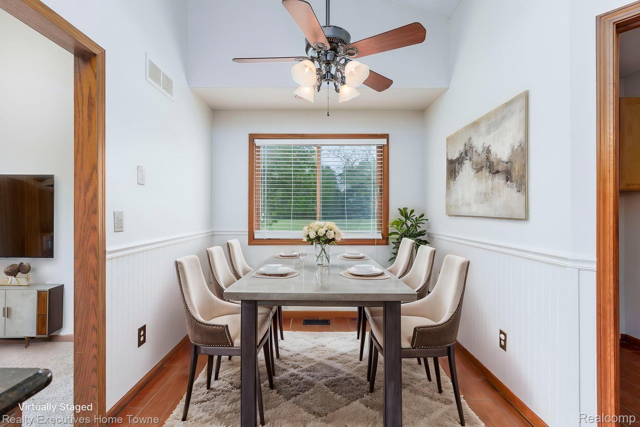 1041 Mackie Road Almont, MI 48003 - Photo 32 of 56 Dining area with wainscoting, a ceiling fan, and wood finished floors