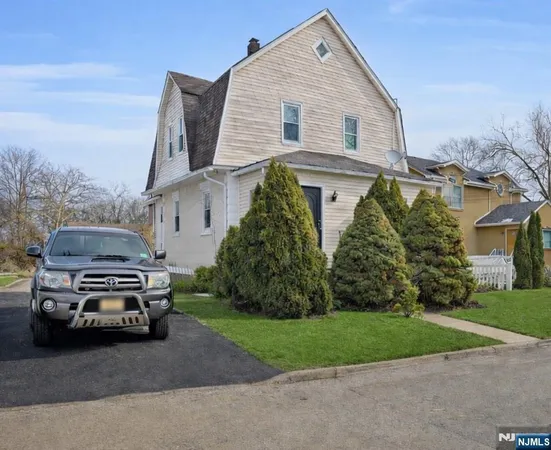 a car parked in front of a house