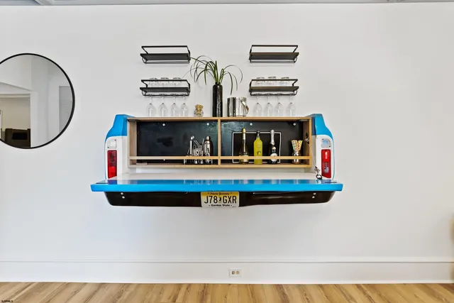 a living room with furniture and a mirror