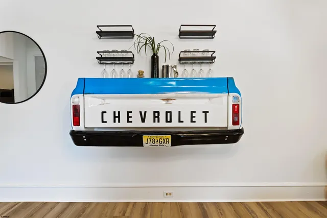 a view of kitchen with stainless steel appliances granite countertop a stove and a microwave