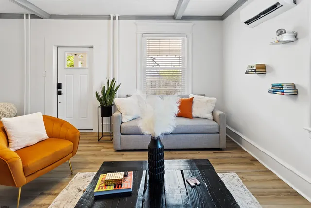 a living room with furniture and a couch