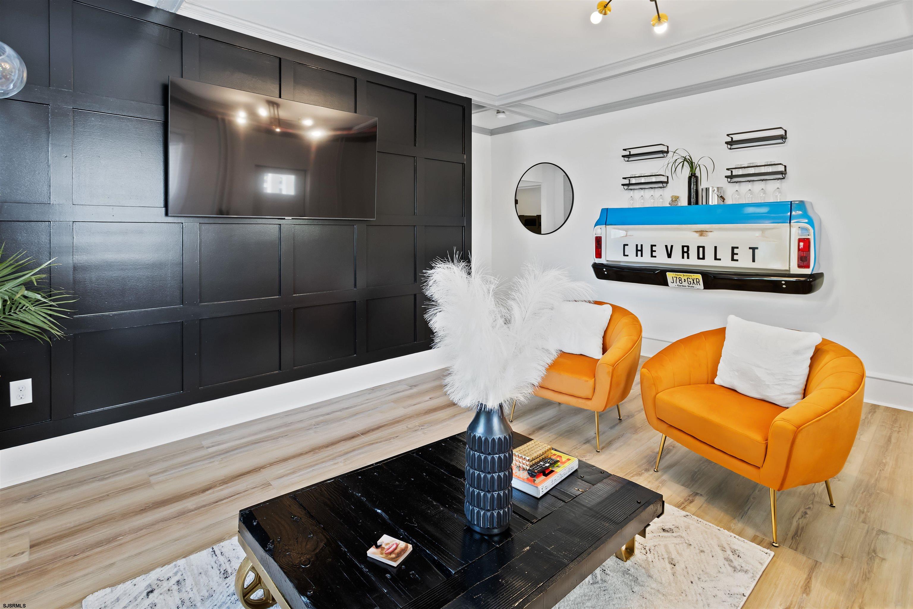 1 South Delancy Place, Unit 1 Atlantic City, NJ 08401 - Photo 16 of 35 a living room with furniture and a wooden floor