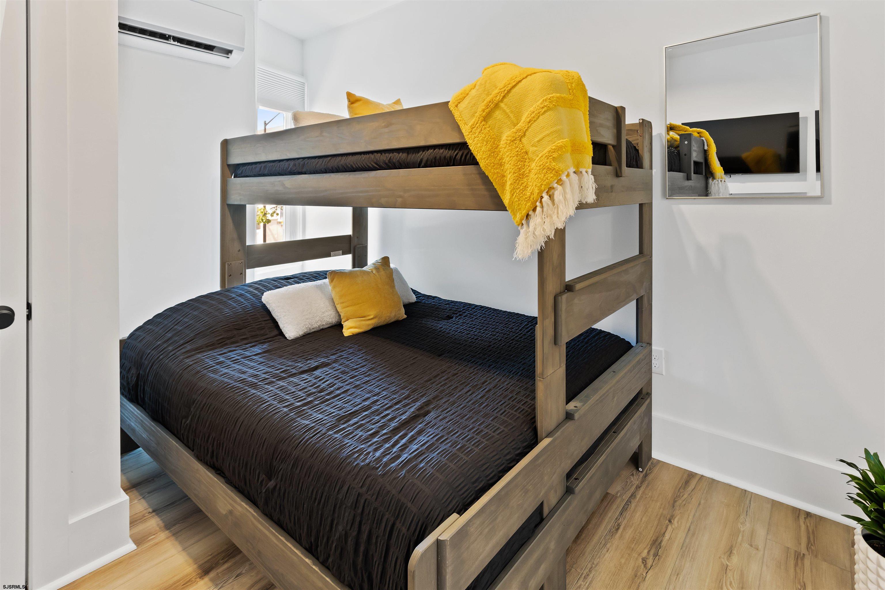 1 South Delancy Place, Unit 1 Atlantic City, NJ 08401 - Photo 19 of 35 a bedroom with a bed and teddy bear on bed