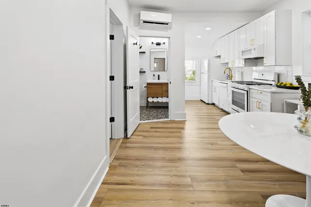 a view of kitchen with wooden floor